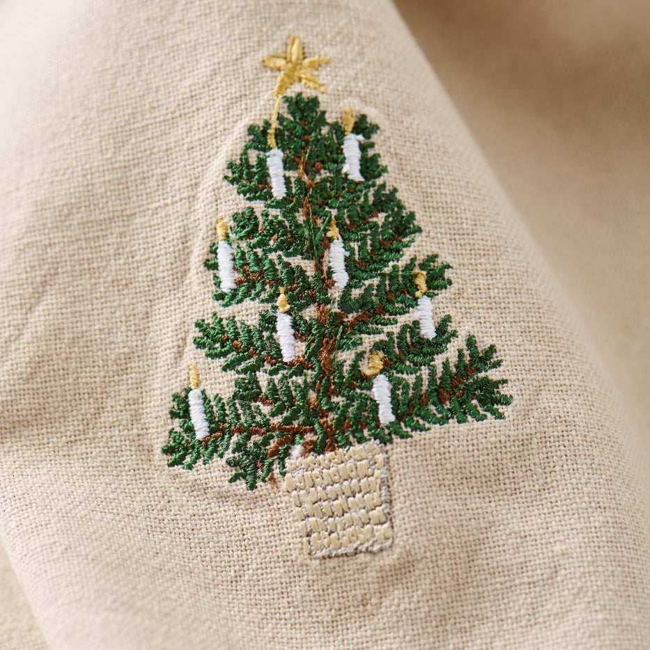 Traditional Napkin Christmas tree in basket w/ white candles