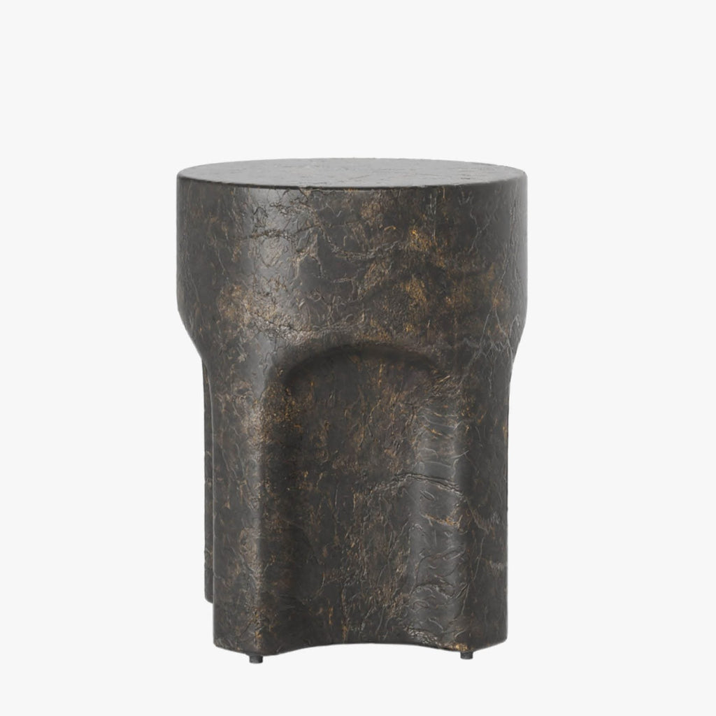 Bronze-colored planter with a unique design on a white background