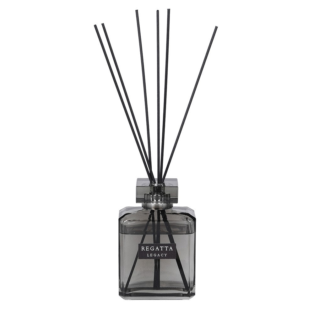 Reed diffuser with black sticks in a clear bottle labeled 'Regatta Legacy' on a white background