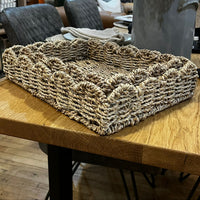 Woven basket on a wooden table with a blurred background