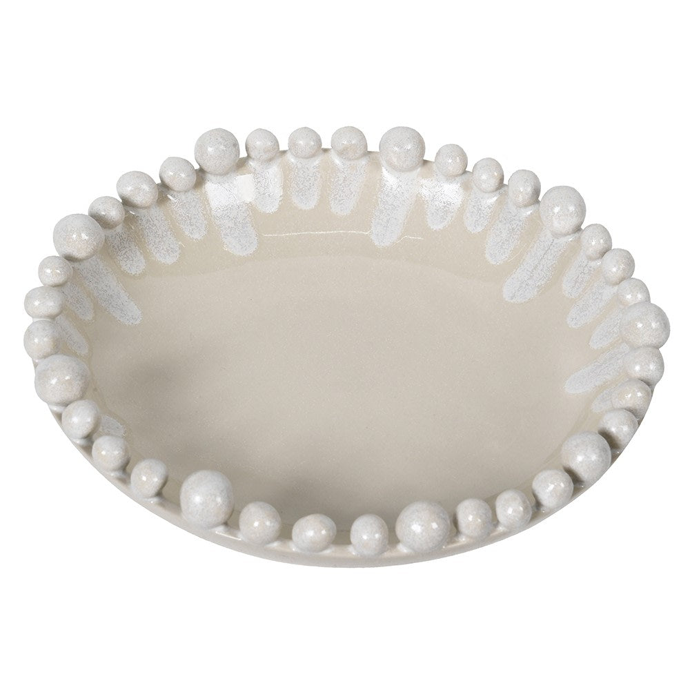 Decorative bowl with pearl-like beads on a white background