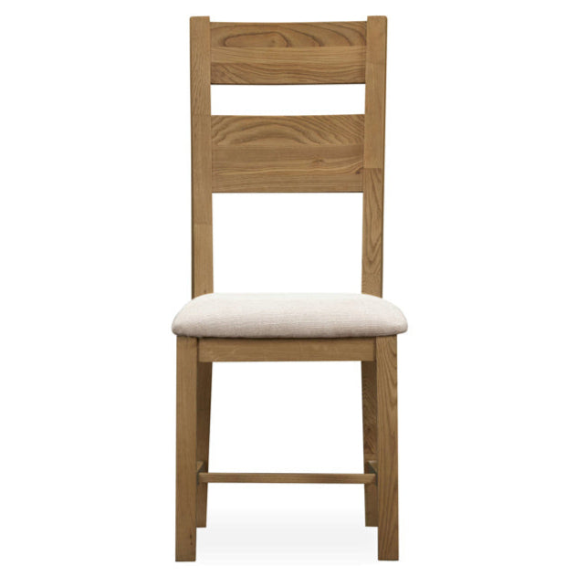 Wooden chair with a white cushion on a white background