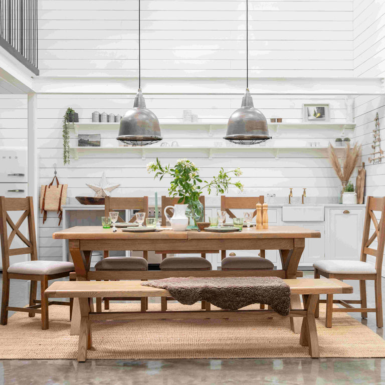 Dining area with wooden table and chairs in a modern kitchen.