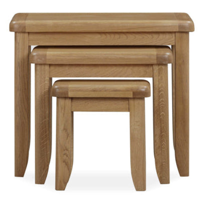 Set of three wooden nesting tables on a white background