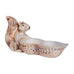 Squirrel figurine inside a shell on a white background