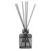 Reed diffuser with black sticks in a clear bottle labeled 'Regatta Legacy' on a white background