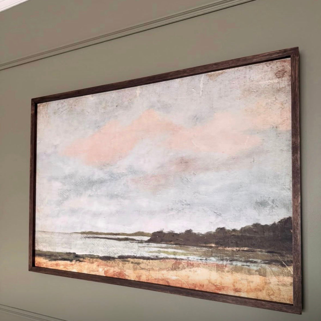 Framed abstract landscape painting on a wall