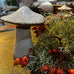 Decorative mushroom with red berries on a table in a room setting