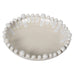 Decorative bowl with pearl-like beads on a white background