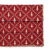Red woven table runner with white tree pattern on a white background