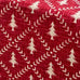 Red fabric with white tree and branch pattern