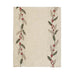 Decorative table runner with holly leaf and berry pattern on a beige background