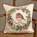 Decorative pillow with a robin design on a wooden chair